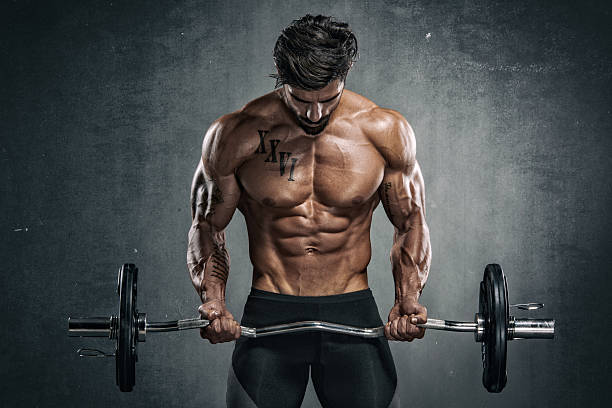 Inicio muscular men exercise with weights. he is performing barbell biceps curls